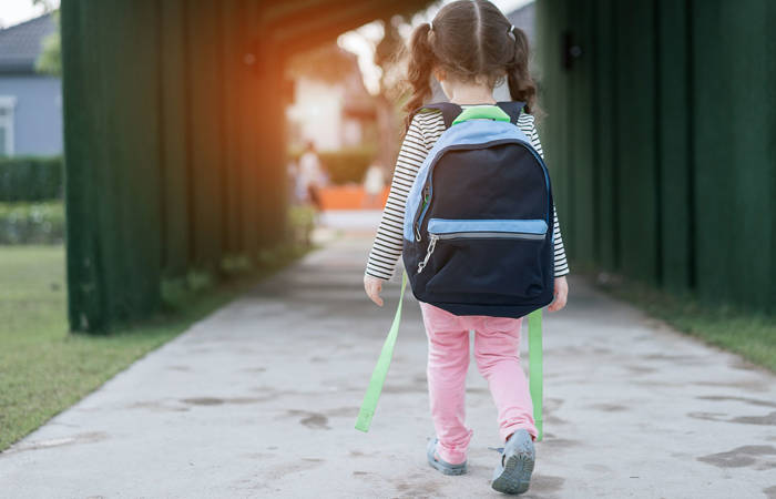 Little girl walking alone after learning