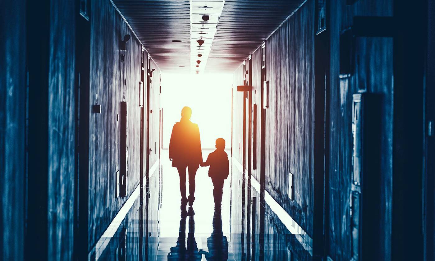 Parent and child walking through school or early learning centre