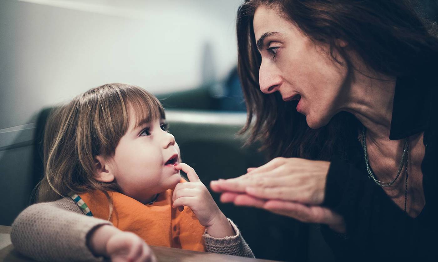 Woman talking to child