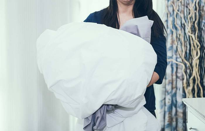 Woman washing sheets