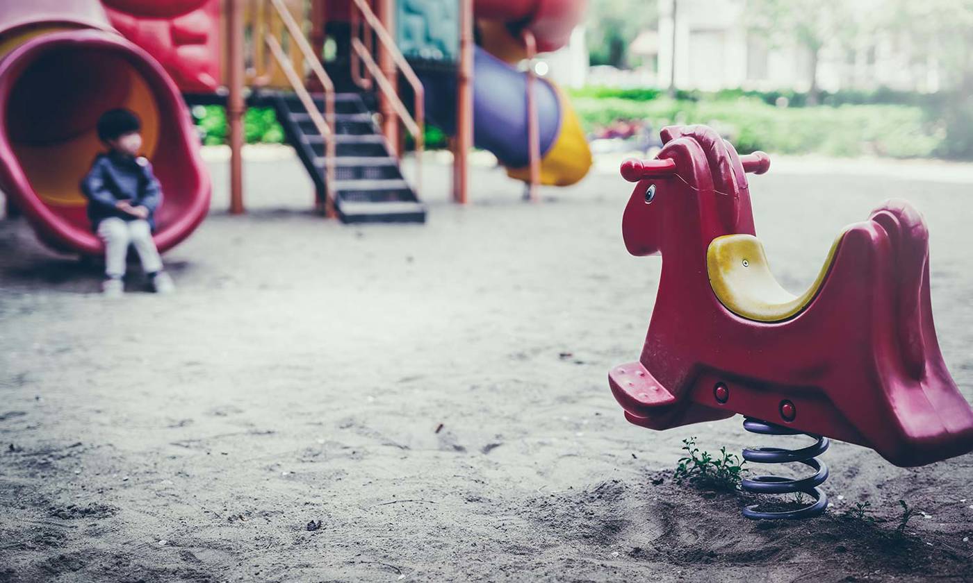 Child alone in a playground
