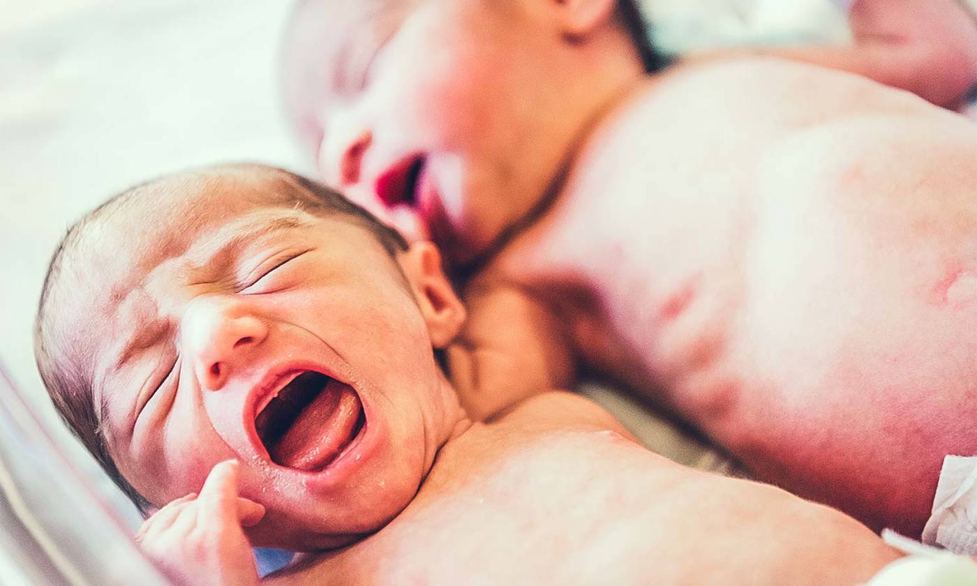 twin newborns crying