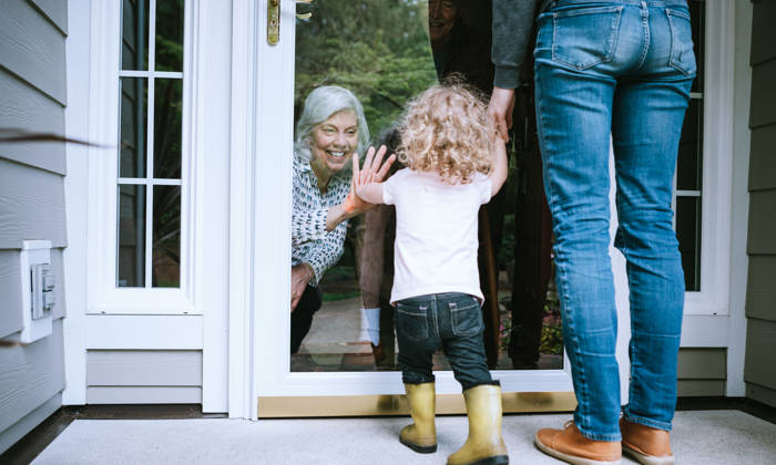 Little girl visits her grandparents with her parents