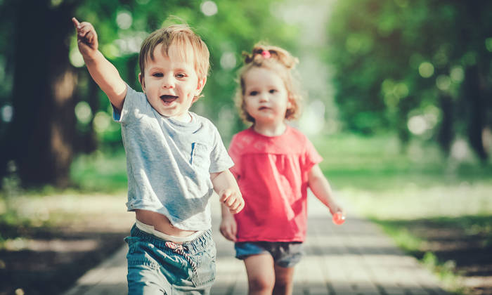 Happy children having fun in summer park