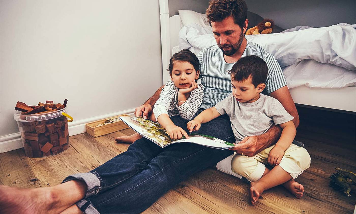 Father reading with children