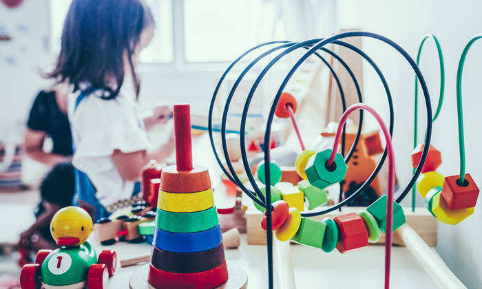 Young girl playing with toys