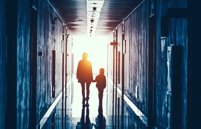 Parent and child walking through school or early learning centre