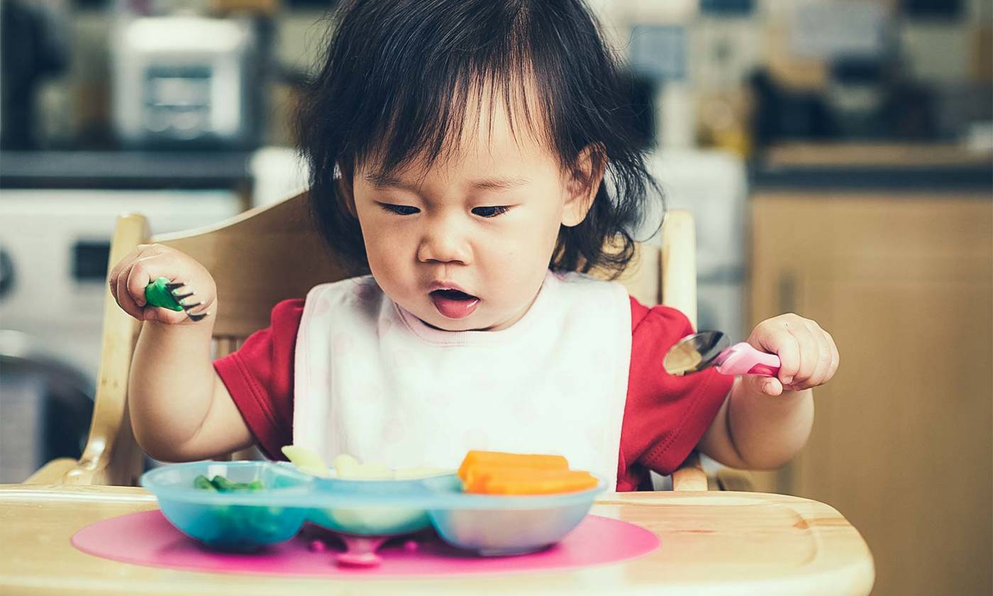 Toddler eating a healthy meal
