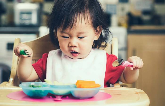 Toddler eating a healthy meal