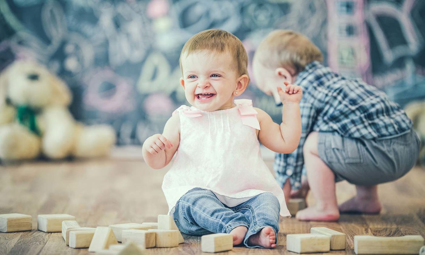 Toddlers playing with blocks