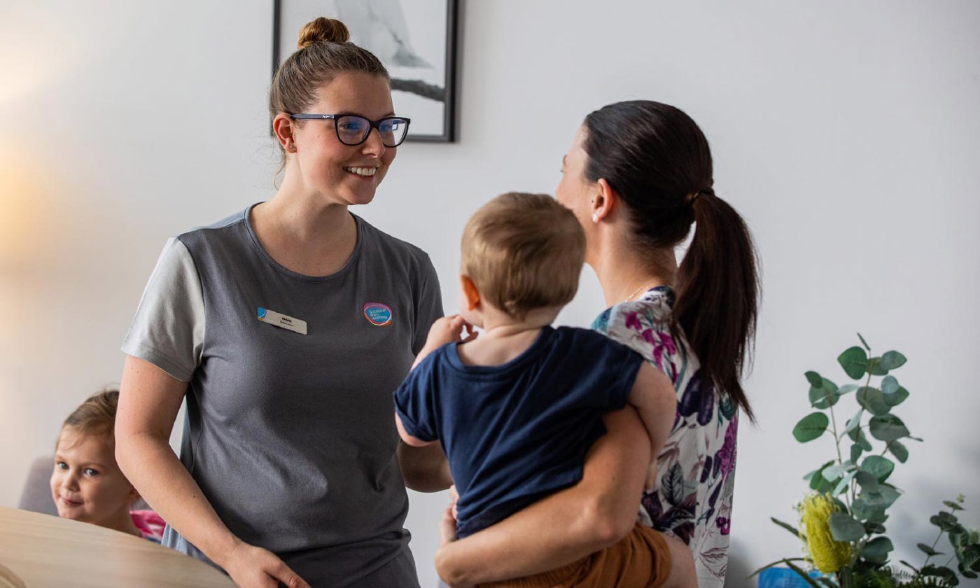 Early learning educator with family