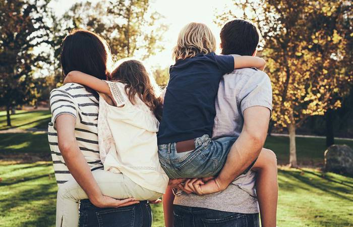 Parents piggy-backing children