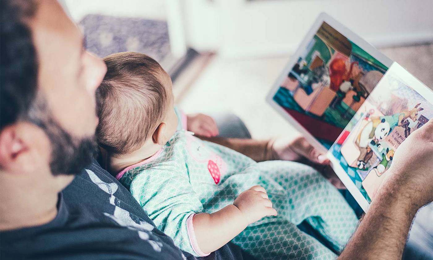 Father reading to baby