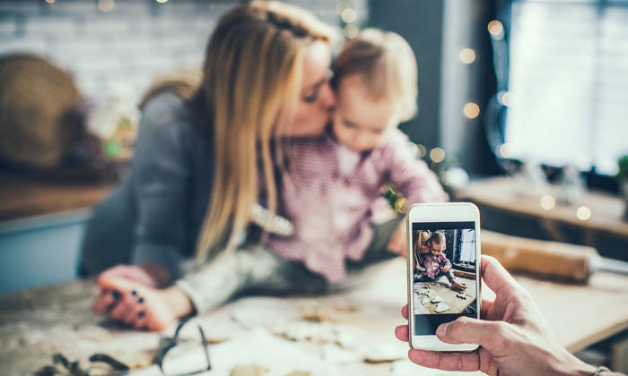 Taking a photo of mother and child