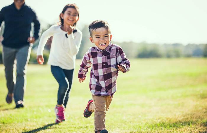 Child playing outside with Dad