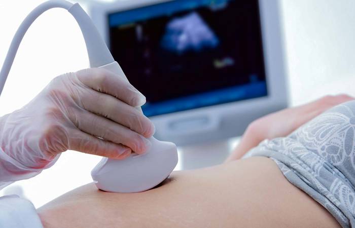 ultrasounds on woman's stomach