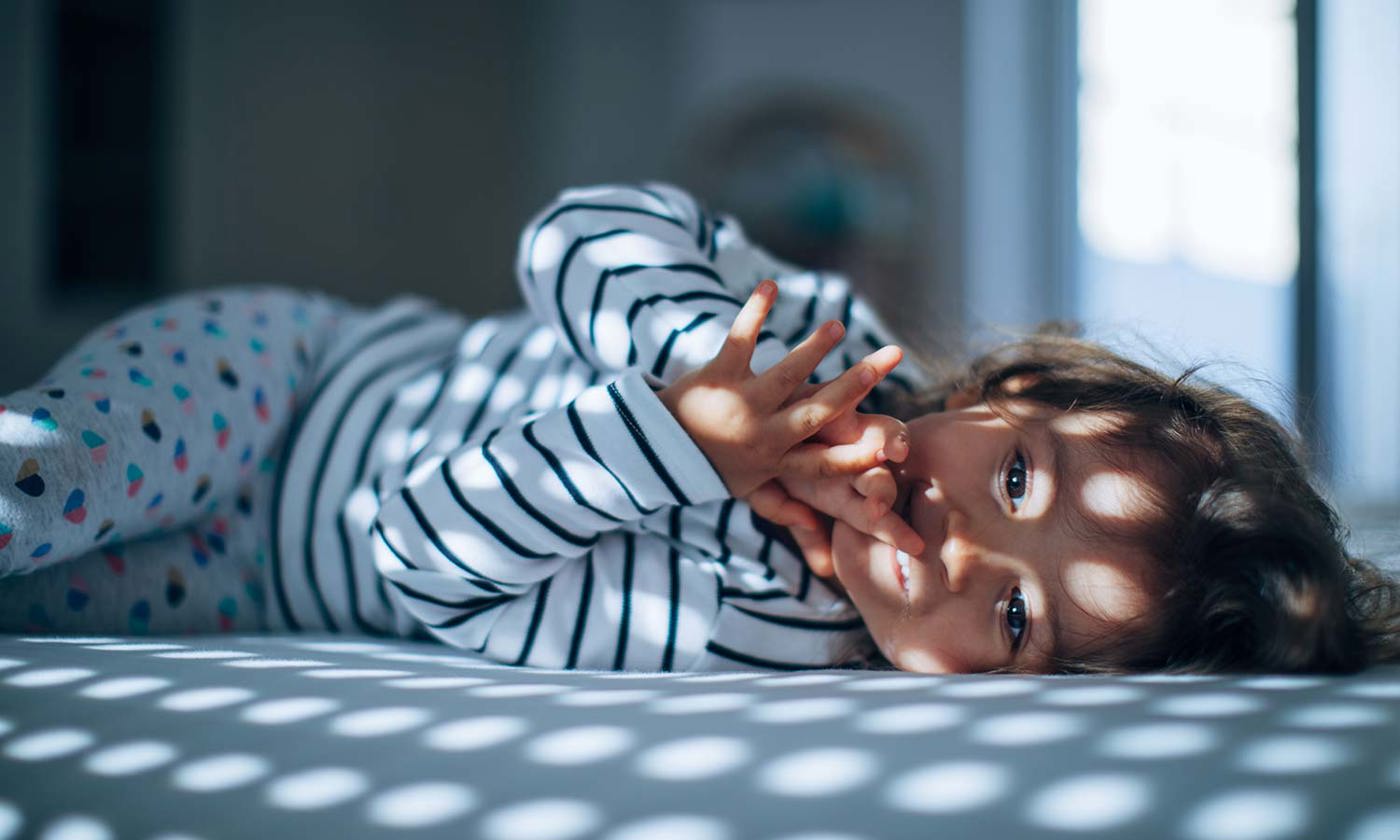 Baby in bed awake