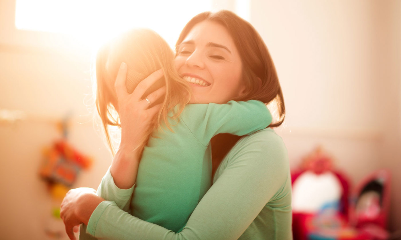 Mother is hugging her daughter