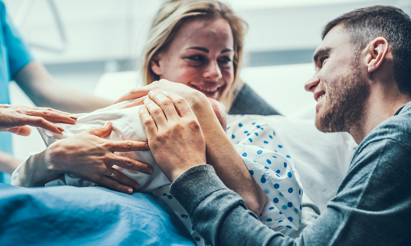 Mother and father with newborn